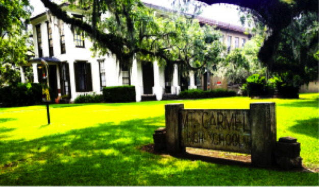 Front view of Mount Carmel Academy featuring the sign.