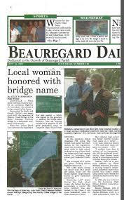 With the help of State Rep. John Smith, Doris Coleman Guillory unveils the sign designating the Hickory Creek Bridge in her name. c. 2007