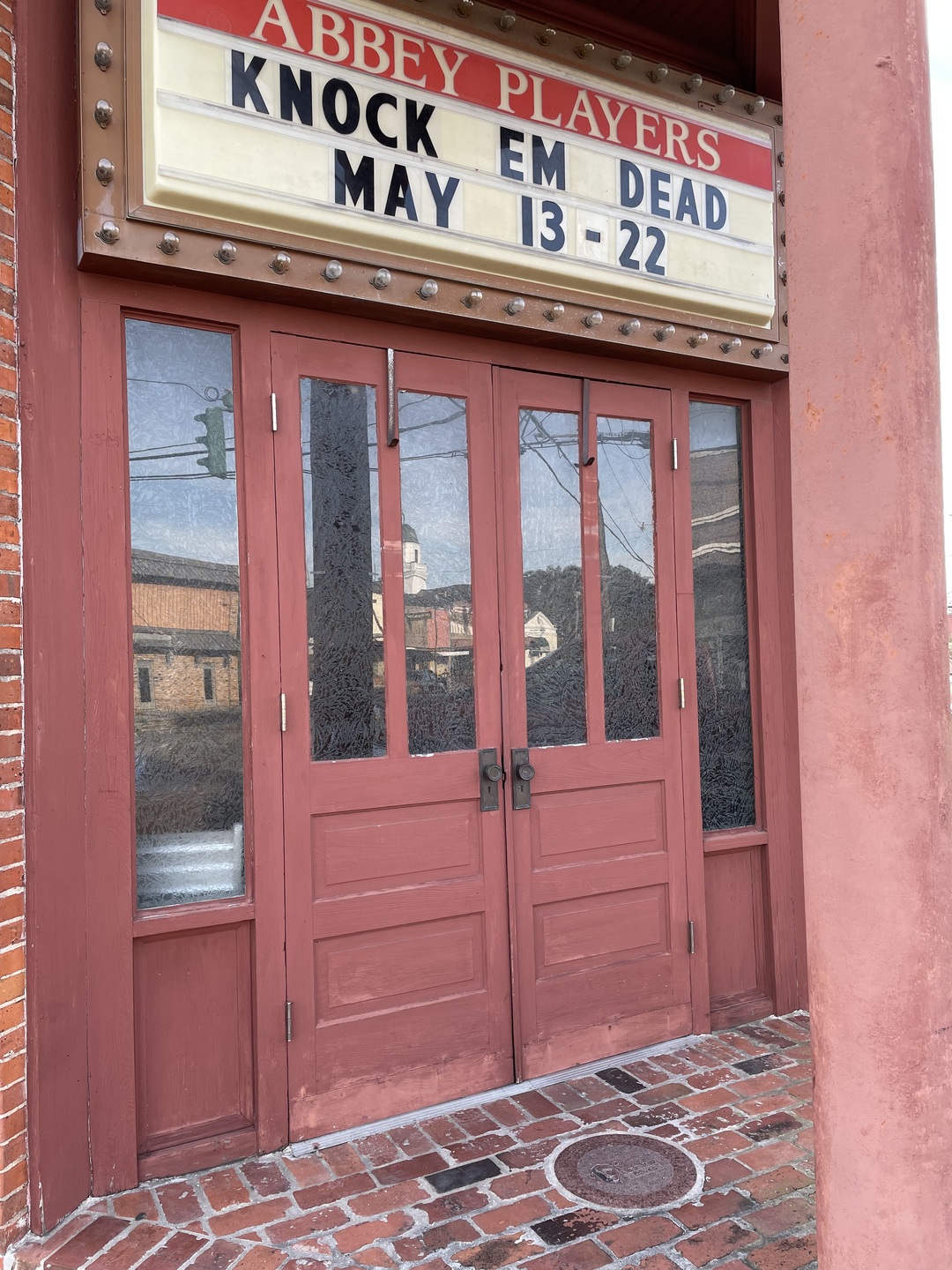 The entrance to the Abbey Players Theater with an upcoming performance