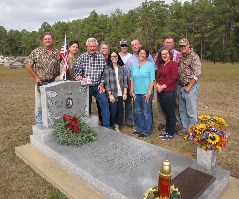 SSG Manuel's family at his grave