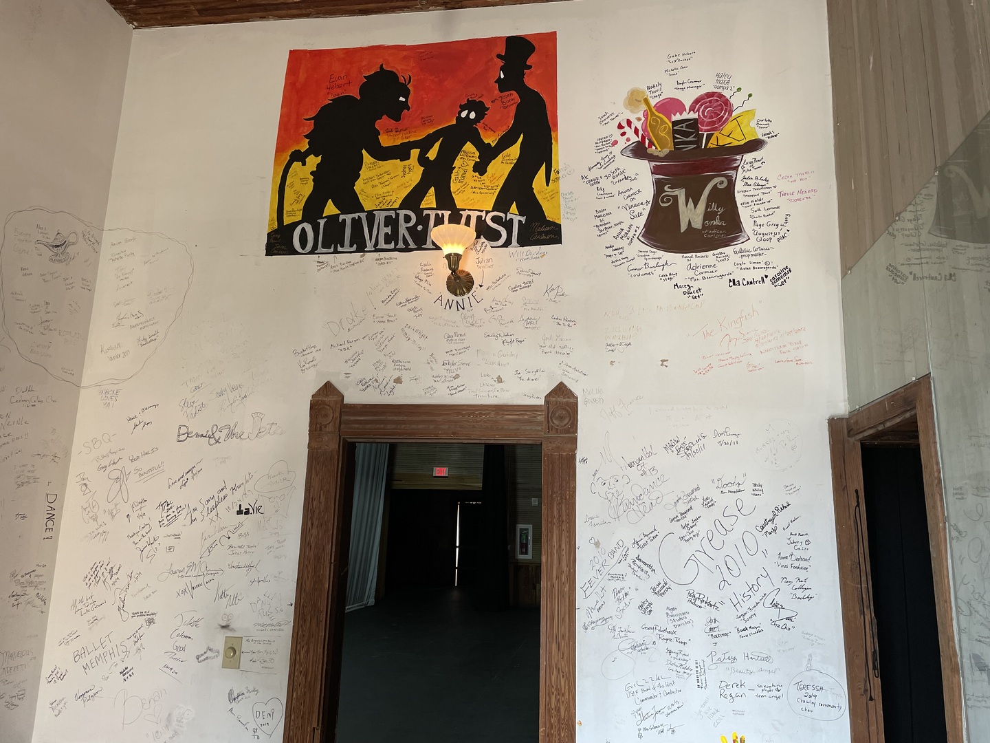 Modern markers by previous children's plays with actors' names and sayings. Some art of plays is shown too.