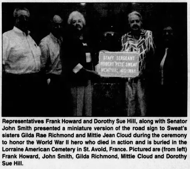 SSG Robert Sweat's family presented with a replica of the road sign