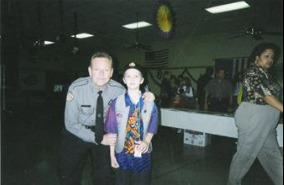 Younger version of officer Johnny Wyatt dressed in full uniform