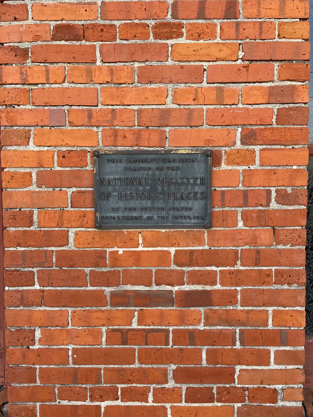 A close up of the official National Historic Register for the theater on the location's side.